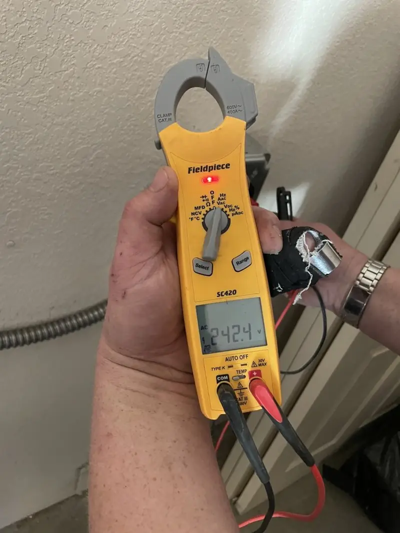 Voltage testing with clamp meter during Generator Installation in Kelly Ridge